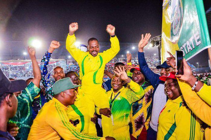 Ogun state sports commissioner celebrating the bid win