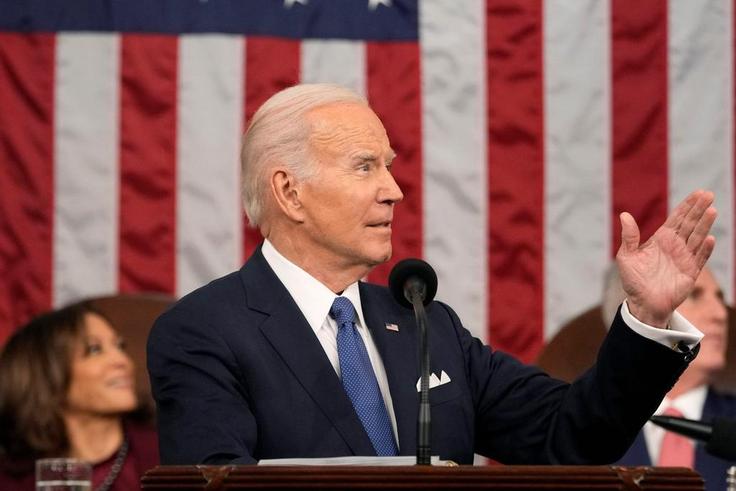 President Joe Biden gestures toward first lady Jill Biden as he delivers the State of the Union address to a joint session of Congress on February 7, 2023 in the House Chamber of the U.S. Capitol in Washington, DC. The speech marks Biden's first addres...