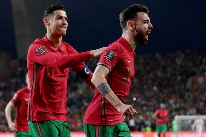 Bruno Fernandes and Cristiano Ronaldo celebrating a goal for Portugal