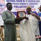 Former Chief of Army Staff, retired Lt.-Gen. Tukur Buratai receiving award of Philanthropy per Excellence form the President, Forum of Ex-Councilors, Mr Awwal Hassan on Thursday (24/11/22)