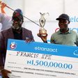 eTranzact MD/CEO, Niyi Toluwalope, presents a trophy and cash prize to the eTranzact Golf Classic champion, Francis Epe.
