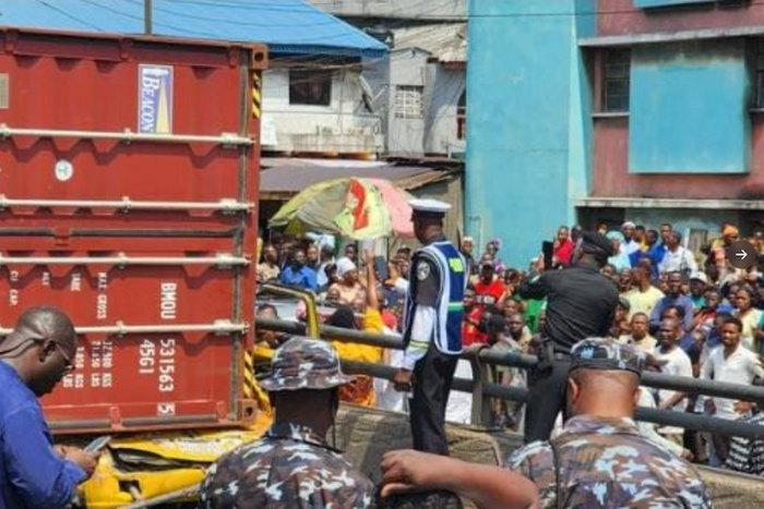 Container falls off truck in Lagos, crushes 9 passengers to death.