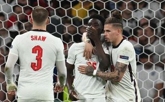 England players console Bukayo Saka after his penalty miss in Euro 2020