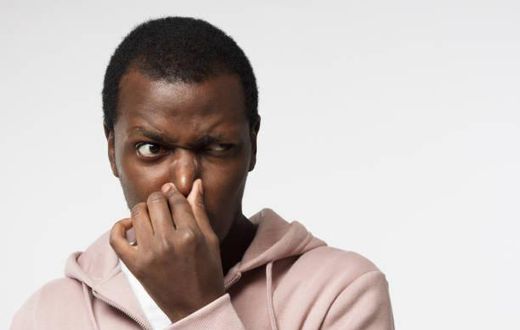 Black man holding his nose (image used for illustration) [iStock]