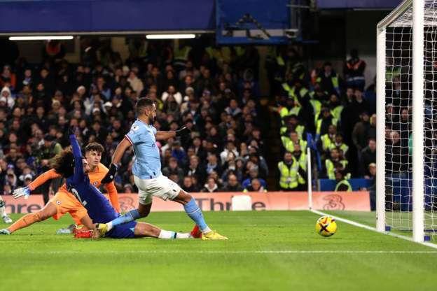 Riyad Mahrez scores the only goal of the game for Manchester City against Chelsea