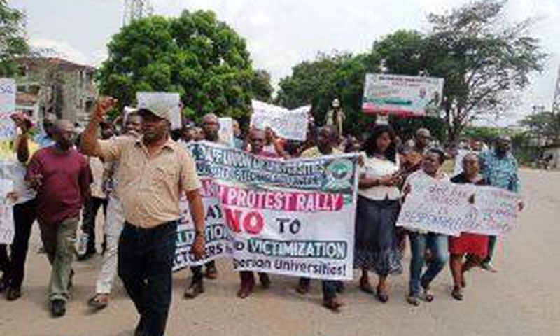 Members of the Academic Staff Union of Universities (ASUU), Federal University of Technology Owerri (FUTO) chapter in a protest march, in Owerri, on Thursday.