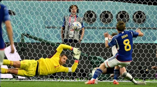 Ritsu Doan scores the equaliser for Japan.