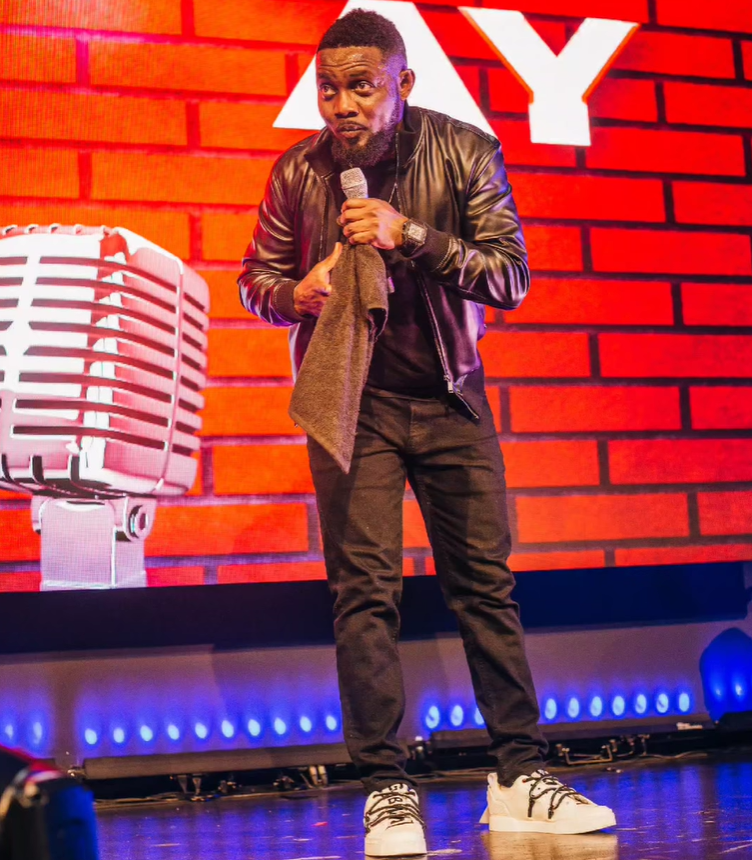 Ayodeji "AY" Makun during the performance of AY: Spotting the Difference [Instagram/@aycomedian]
