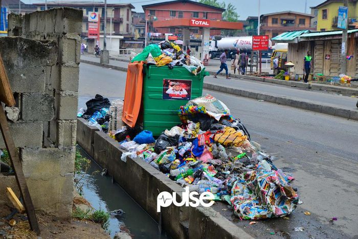 Waste often overflows into drainage channels in Lagos