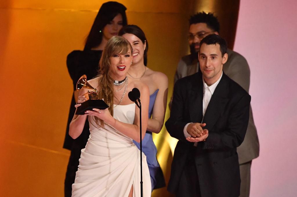 Taylor Swift accepts the award for album of the year at the 2024 Grammys.Valerie Macon/AFP via Getty Images