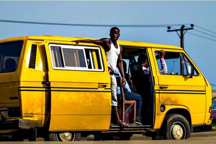 A bus conductor in Lagos.