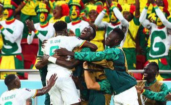 Senegal celebrating after becoming one of only two African nations to advance to the round of 16 of the World Cup in Qatar
