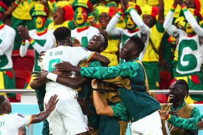 Senegal celebrating after becoming one of only two African nations to advance to the round of 16 of the World Cup in Qatar
