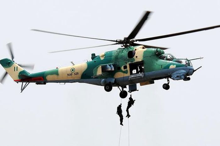 The Nigerian Air Force officers descend from one of the Nigerian fighter jets. [Punch]