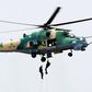 The Nigerian Air Force officers descend from one of the Nigerian fighter jets. [Punch]