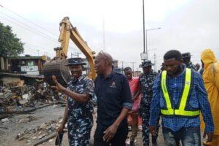 Special Intervention Team during clean up of shanties on Sunday along Lagos-Badagry Expressway. [NAN]