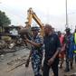 Special Intervention Team during clean up of shanties on Sunday along Lagos-Badagry Expressway. [NAN]