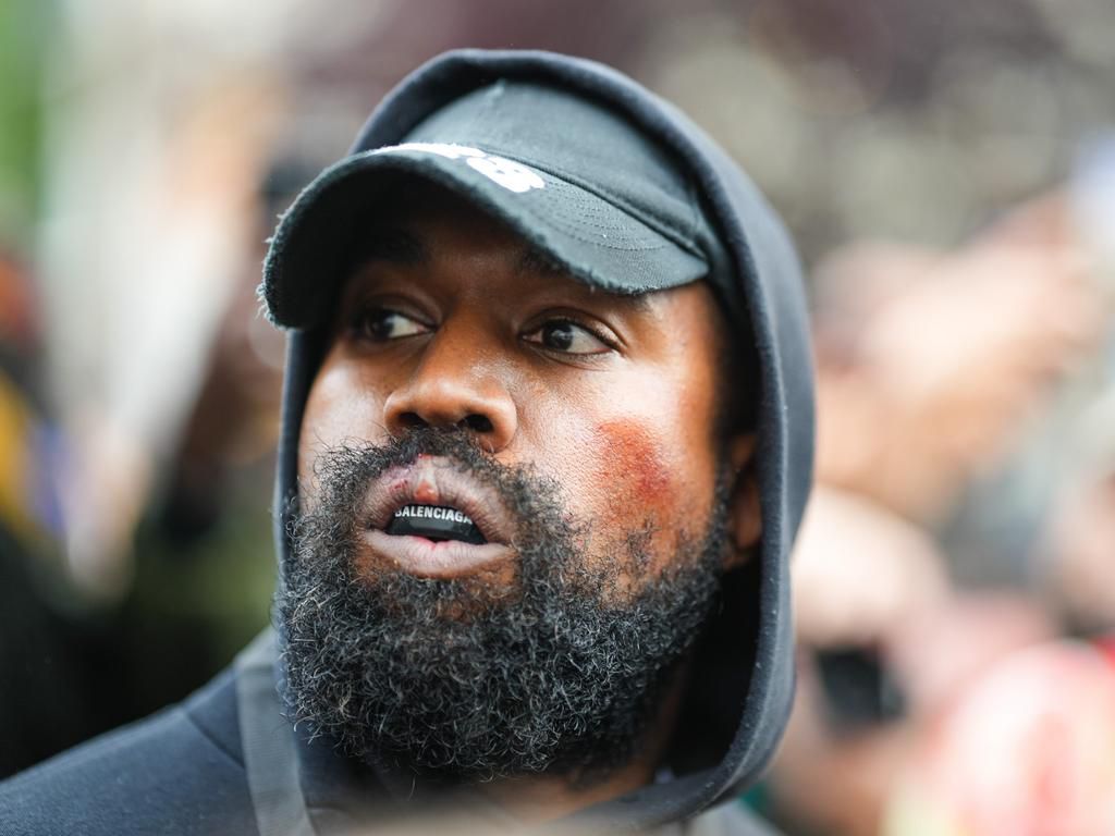 Ye, who is also known as Kanye West, is seen wearing a Balenciaga boxing mouthguard, outside Givenchy, during Paris Fashion Week.Edward Berthelot/GC Images