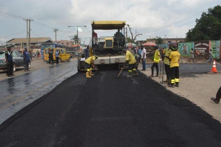 Picture showing officials of the Lagos State Public Works Corporation (LSPWC) during road rehabilitation in the Iju area of the state. [PM News]
