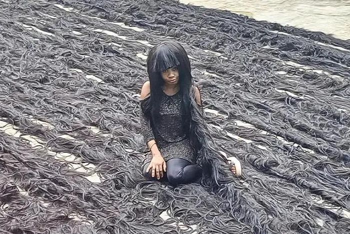 Nigerian lady sets new Guinness World Record for longest handmade wig [TheStar]