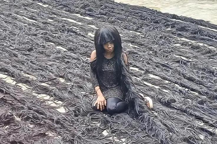Nigerian lady sets new Guinness World Record for longest handmade wig [TheStar]