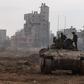 This picture taken during a media tour organized by the Israeli military on Jan. 8, 2024, shows troops operating in the area of al-Bureij in the central Gaza Strip.Photo by MENAHEM KAHANA/AFP via Getty Images