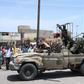 Sudanese greet army soldiers, loyal to army chief Abdel Fattah al-Burhan, in the Red Sea city of Port Sudan on April 16, 2023.AFP via Getty Images