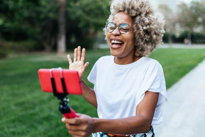 A vlogger recording content for her social networks with a mobile phone at the parkXavier Lorenzo/Getty Images