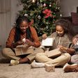 A Black family during Christmas [Freepik]