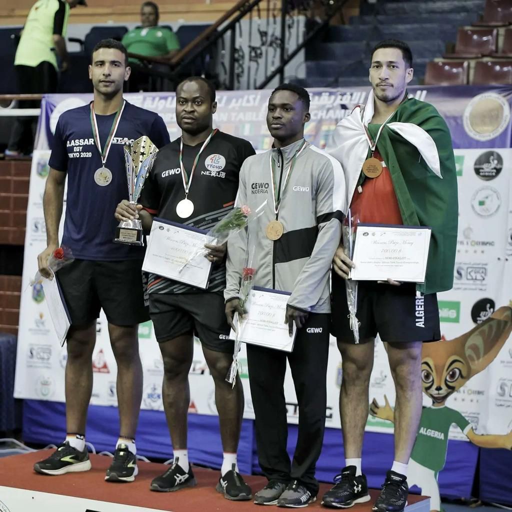 Mati Taiwo on a podium with Quadri Aruna, Omar Assar and Bouloussa Mehdi