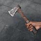 A black hand holding an axe [iStock]