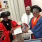 Former EFCC Boss, Ibrahim Magu, receiving award of Doctoral Fellowship of the Institute for Governance and Leadership Studies in Africa (IGLSA) in Abuja on Saturday (18/11/23) [NAN]