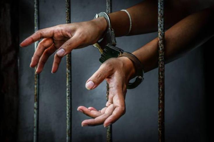 Sock photo: Woman handcuffed