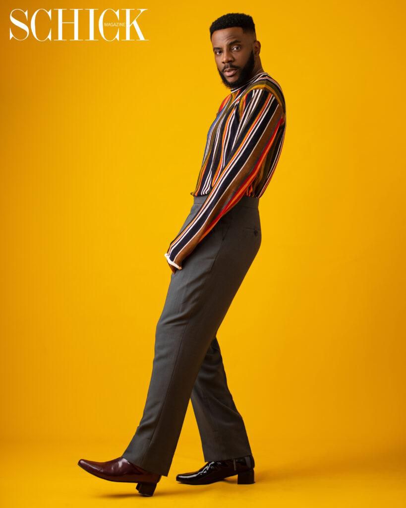 Ebuka is in a stripped long sleeved shirt, green pants and shoes from King David {schick}