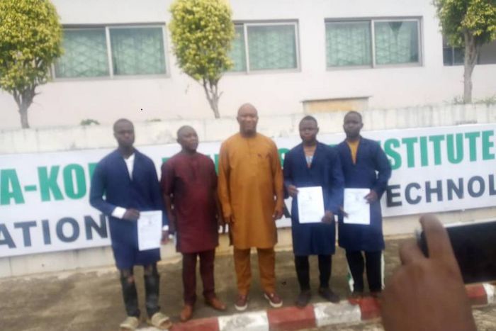 Rector of Korea-Nigeria Friendship Institute (NKFI) of Vocational and Advanced Technology, Lokoja, Mr Williams Charles (middle), Principal of St. Peter’s College, Idah, Mr Zakari Jonah, (second left) in a group photograph with the students who were awa...