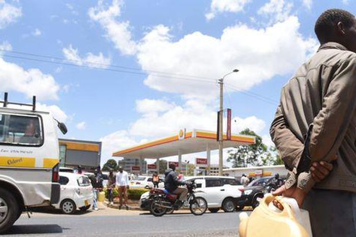 A man with jerrycans waits to buy fuel in Eldoret town on April 3, 2022 amid a biting shortage. Kenya is staring at a fuel crisis due to delays in subsidy payouts by the government. Jared Naytaya | Nation Media Group
