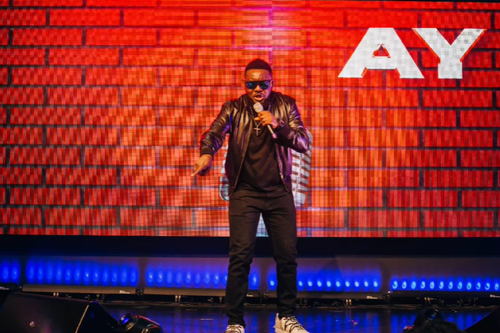 Ayodeji "AY" Makun during the performance of AY: Spotting the Difference [Instagram/@aycomedian]
