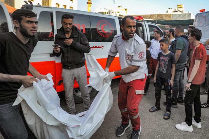 The body of a victim killed in an Israeli bombardment is taken out of an ambulance in Gaza City.DAWOOD NEMER/AFP via Getty Images