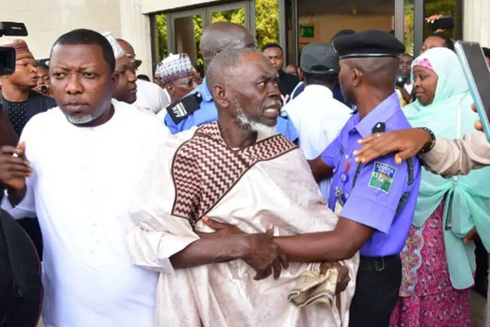 Lamidi Apapa being whisked away by security operatives after Obidients attacked him at the Appeal Court, Abuja [TheWhistle]