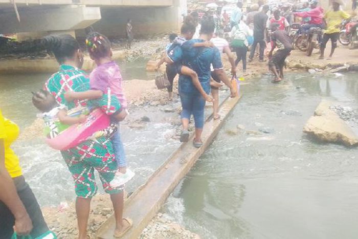 Ogun residents raise alarm after flood sweeps away bridge