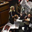 Pro-government MPs attempted to seize placards held by opposition members bearing messages such as "With political prisoners, there is no democracy" [Sun News]