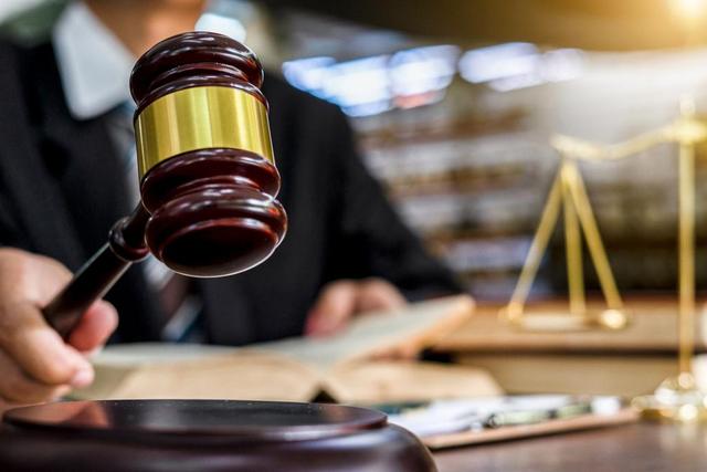 A judge uses a gavel in a courtroom.Naruecha Jenthaisong/Getty Images