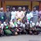 Dr Mathew Ashikeni, Director, Special duties, FCT Health and Human Services Secretariat and  Mrs Eze pose for a picture with students of Government Secondary School, Life camp, Gwarimpa Abuja where the event held. [NAN]