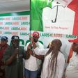 PDP Chairman, Mr Philips Aivoji, handling over the party’s flag to the leader of the defectors, Miss Dabiraoluwa Adeyinka on Monday in Lagos.