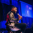 Ayodeji "AY" Makun during the performance of AY: Spotting the Difference [Instagram/@aycomedian]