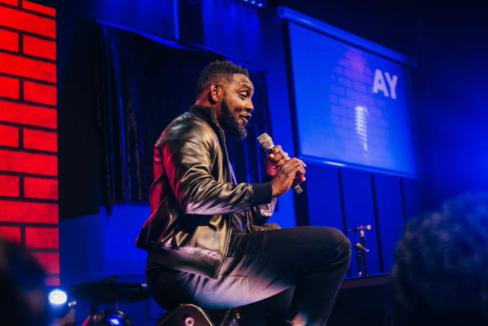 Ayodeji "AY" Makun during the performance of AY: Spotting the Difference [Instagram/@aycomedian]