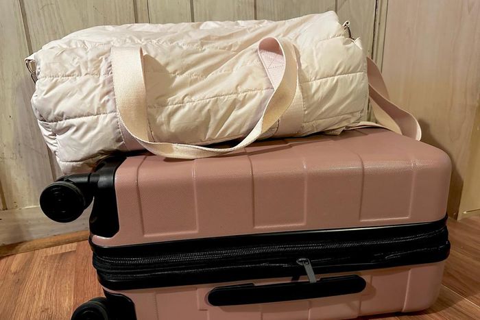 I recently ditched this duffel bag in favor of the pink roller suitcase beneath it.Amanda Krause/Insider