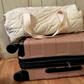 I recently ditched this duffel bag in favor of the pink roller suitcase beneath it.Amanda Krause/Insider