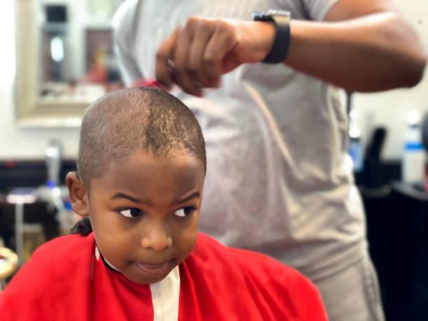 A man getting a haircut in a barbershop
