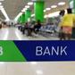 Customers are served at the Kenya Commercial Bank (KCB) in Nairobi on January 24, 2018. (Photo by SIMON MAINA/AFP via Getty Images)